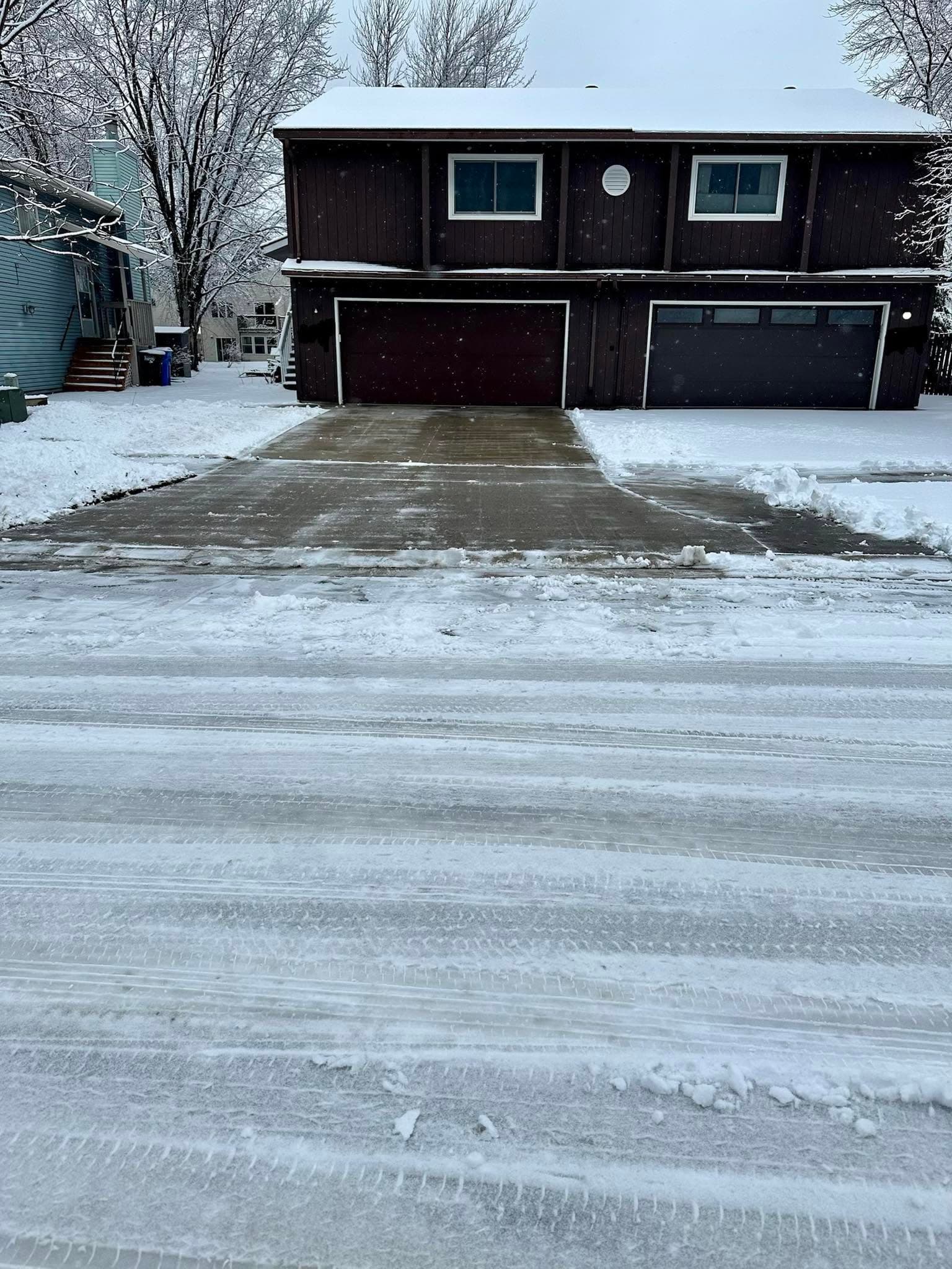 Cleared driveway after snow removal in Fargo ND by Dynamite Lawn & Snow